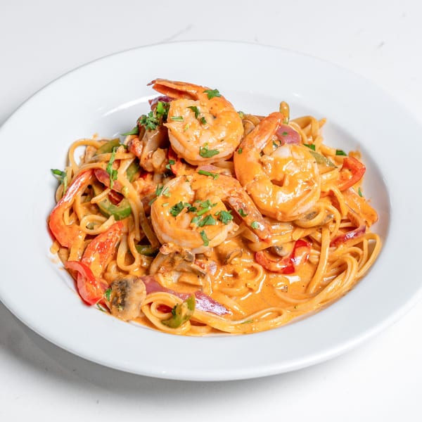 Pear Street Bistro's shrimp linguine with red and green bell peppers, mushrooms, and creamy sauce.