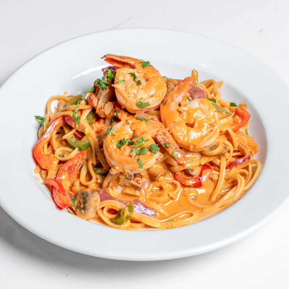 Pear Street Bistro's shrimp linguine with red and green bell peppers, mushrooms, and creamy sauce.